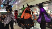 Witches parade on stilts
