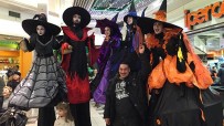 Witches parade on stilts