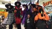 Witches parade on stilts