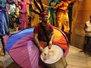 Rainbow parade on stilts by colorful stilt walkers