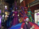 Rainbow parade on stilts by colorful stilt walkers